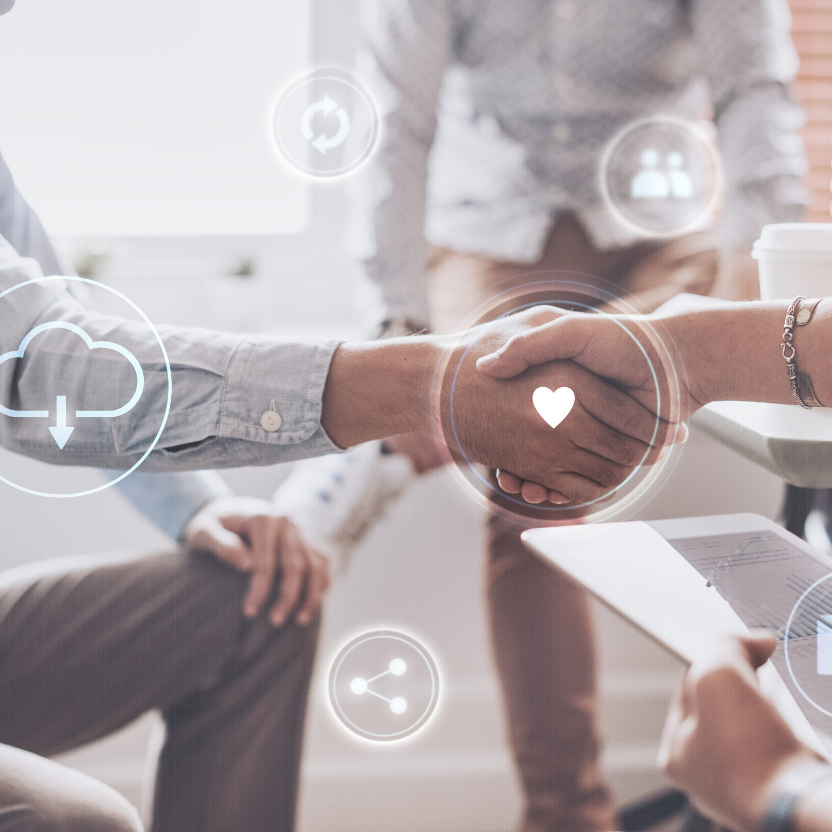 Business professionals shaking hands, symbolizing how to automate employee onboarding with digital workflows.