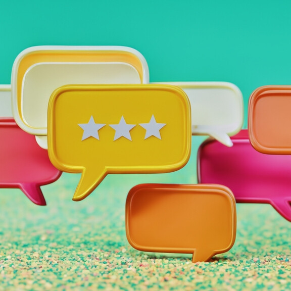 Colorful speech bubbles with stars representing customer reviews, tied to Deel review of HR and payroll platform.